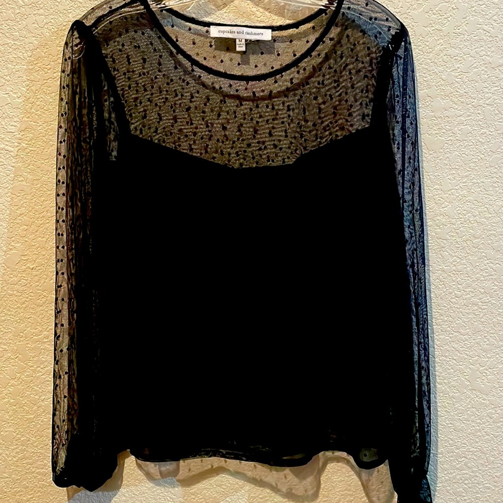 Adorable black lace top with gathered sleeve detail and solid cami lining.